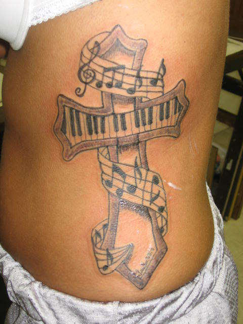 Creative Cross With Piano Keys Tattoo On Side Rib
