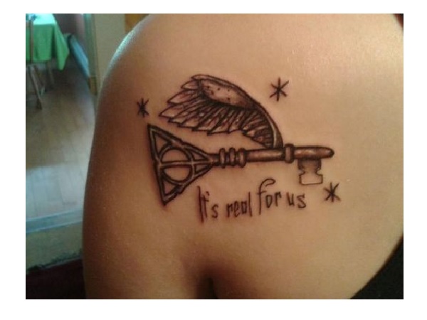 Creative Grey Deathly Hallows Headed Key Having Wings Tattoo