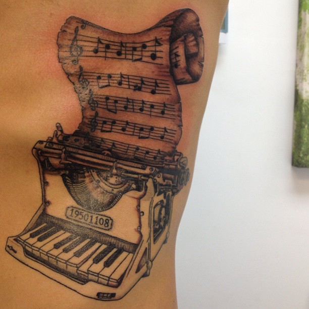 Creative Grey Ink Piano Typewriter And Piano Music Tattoo