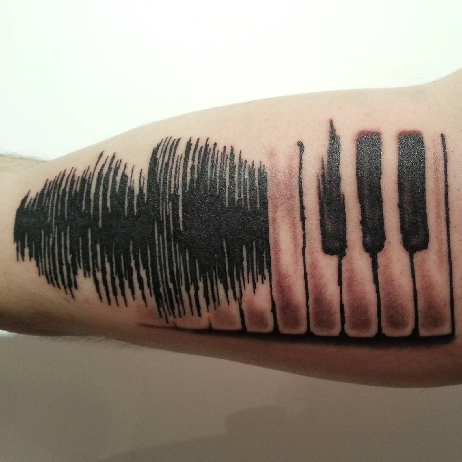 Creative Grey Soundwave Into Piano Keys Tattoo On Bicep