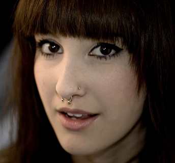 Cute Girl Have Left Nostril And Septum Piercing