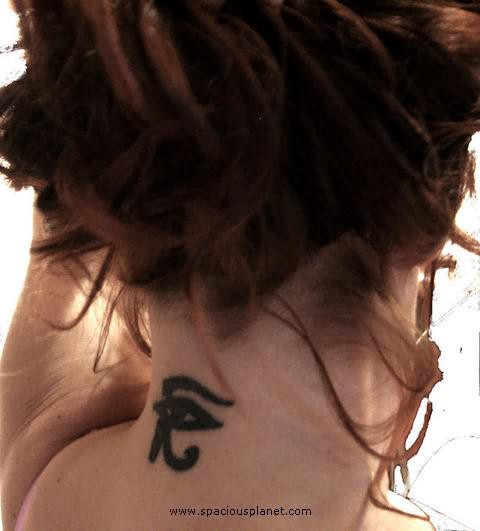 Dark Black Small Horus Eye Tattoo On Back Neck