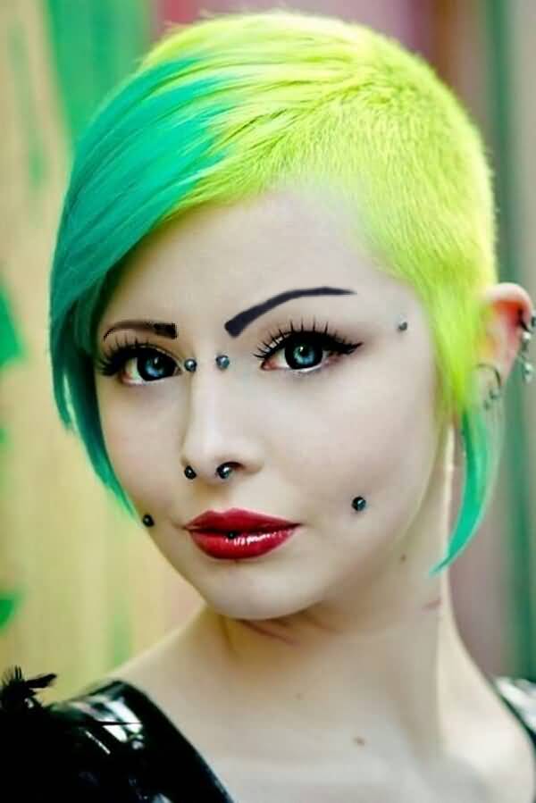 Emo Girl Have Multiple Face And Septum Piercing With Small Black Barbell