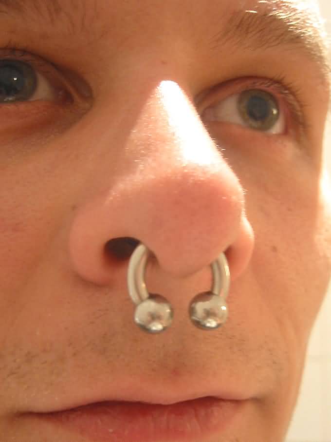 Extreme Septum Piercing With Circular Barbell