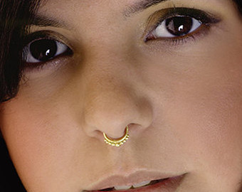 Gold Ring Septum Piercing Closeup Image