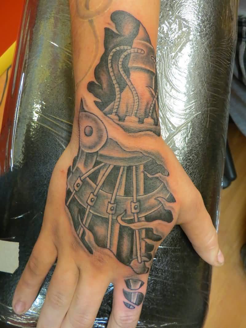 Great Black And White Mechanical Parts Ripped Skin Tattoo On Hand