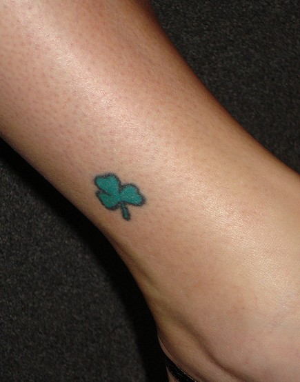 Green Ink Tiny Shamrock Leaf Tattoo On Ankle