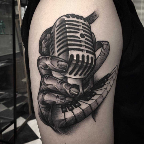 Grey And Black Piano Keys With Microphone Tattoo On Right Shoulder