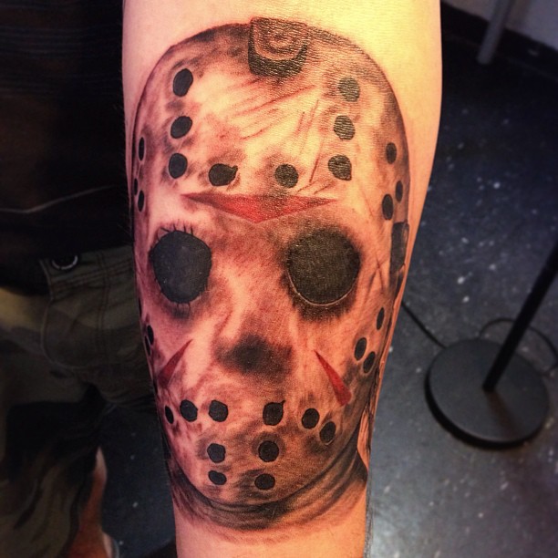 Grey And Red Jason Mask Tattoo