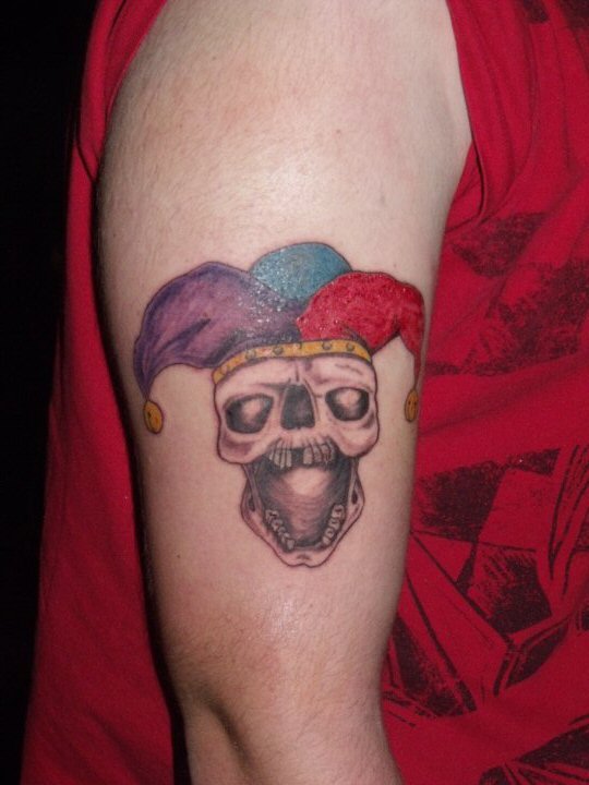 Grey Ink Evil Jester With Colorful Cap Tattoo On Right Half Sleeve By C Cross