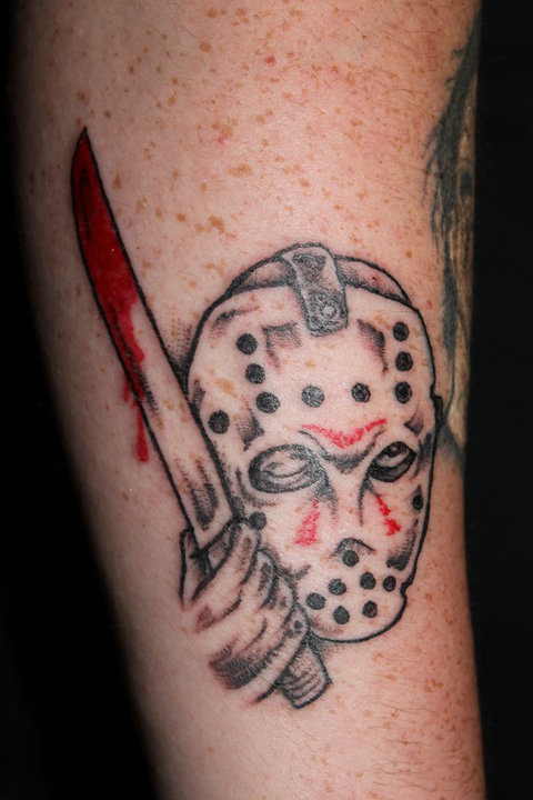 Grey Ink Jason Holding Sword Tattoo