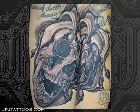 Grey Ink Laughing Jester Skull Tattoo