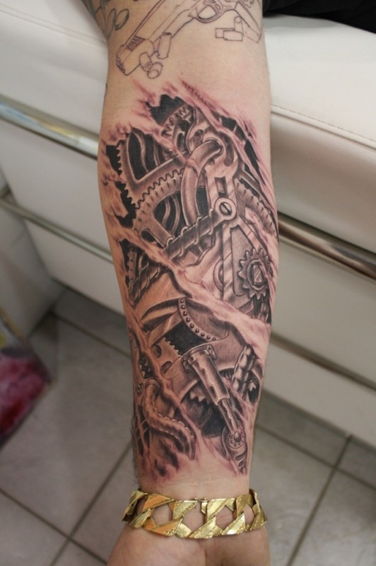 Grey Ink Mechanical Engine Tattoo On Forearm