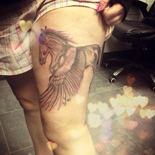 Grey Ink Pegasus Tattoo On Thigh