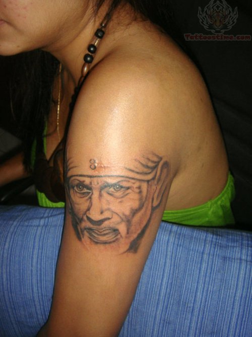 Grey Sai Baba Face Tattoo On Left Shoulder