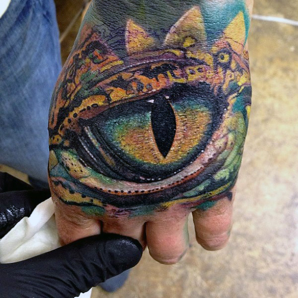 Huge Reptile Eye Tattoo On Hand