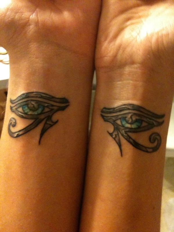 Impressive Grey Horus Eye With Blue Eyeball Matching Tattoo On Both Wrist