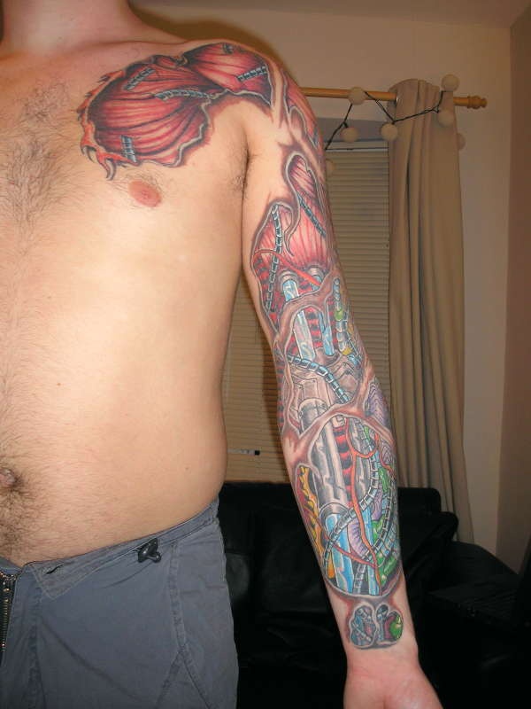 Impressive Multicolored Muscles Tattoo On Left Chest And Full Sleeve