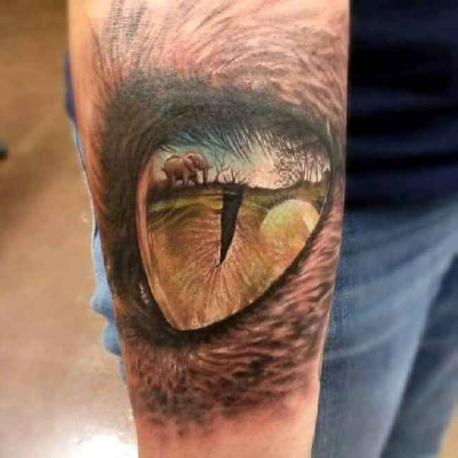 Incredible 3D Elephant View In Reptile Eye Tattoo On Arm