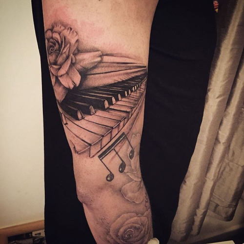 Inspiring Grey Rose On Piano Keys Tattoo On Arm Sleeve