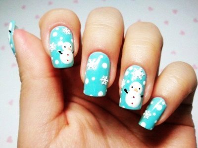 Light Blue Nails With Snowflakes And Snowman Design Idea