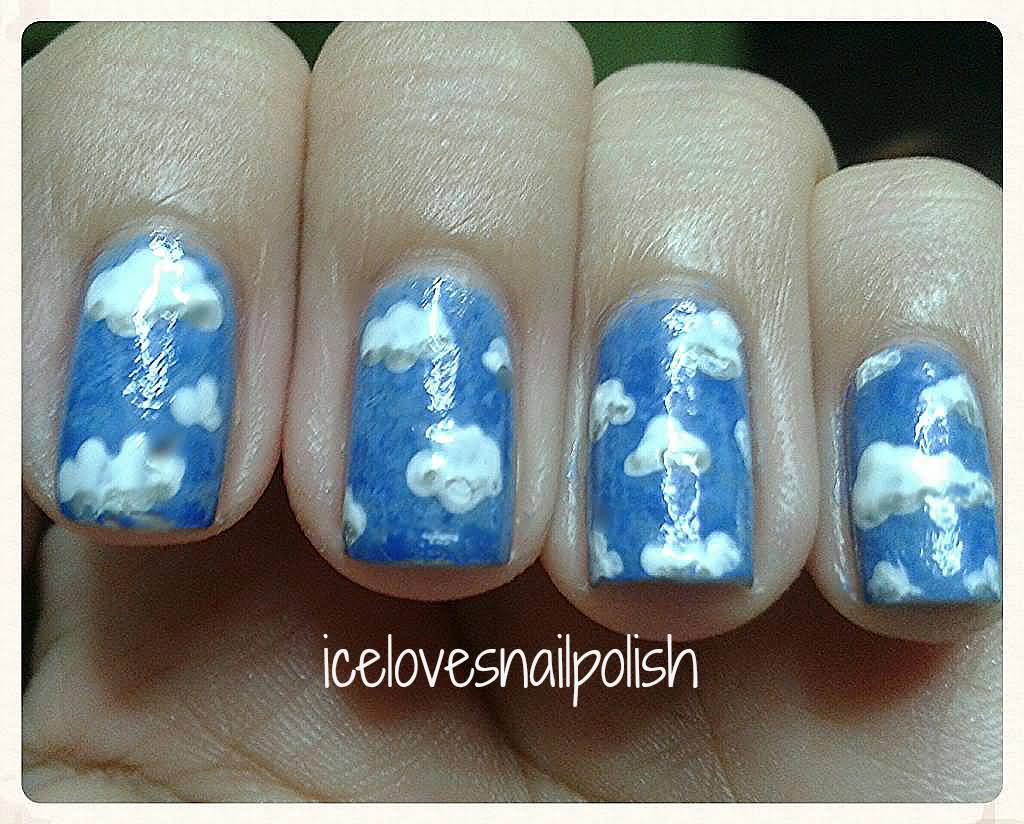 Light Blue Nails With White Clouds Design Nail Art