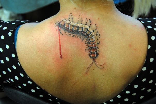 Lovely 3D Worm Ripped Skin Tattoo On Upper Back