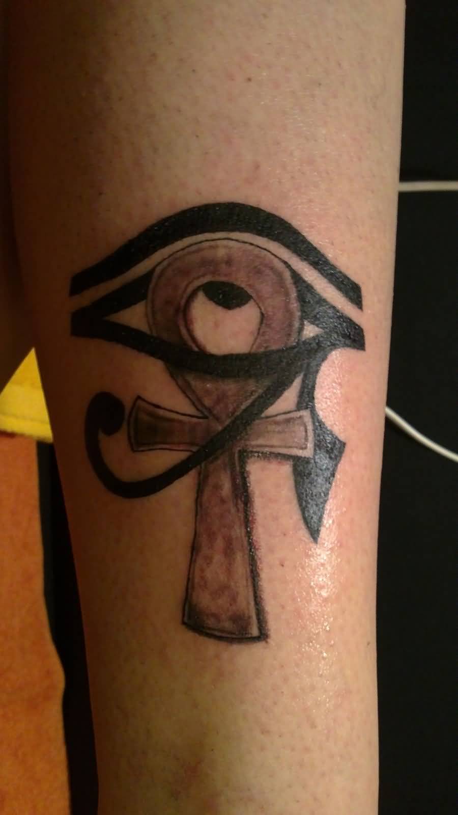 Lovely Black And Grey Ankh Horus Eye Tattoo