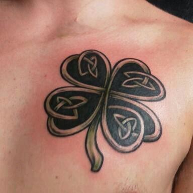 Lovely Grey And Black Celtic Shamrock Tattoo On Left Chest For Men