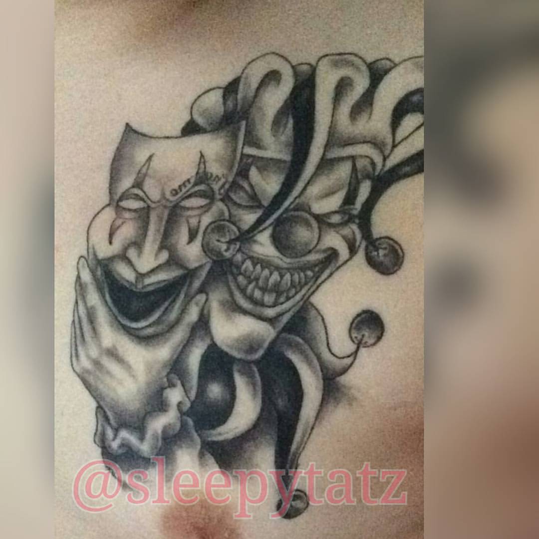 Lovely Grey Ink Jester Holding Mask Tattoo