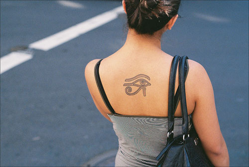 Lovely Horus Eye Tattoo On Upper Back For Girls