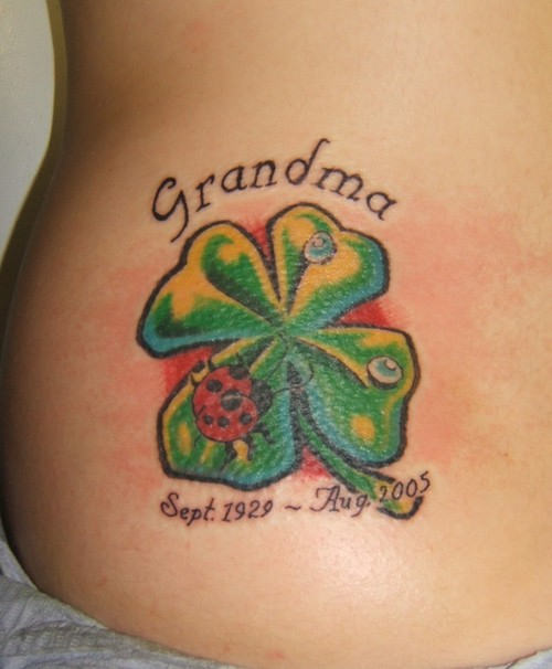 Lovely Lady Bug On Four Leaf Shamrock Memorial Tattoo