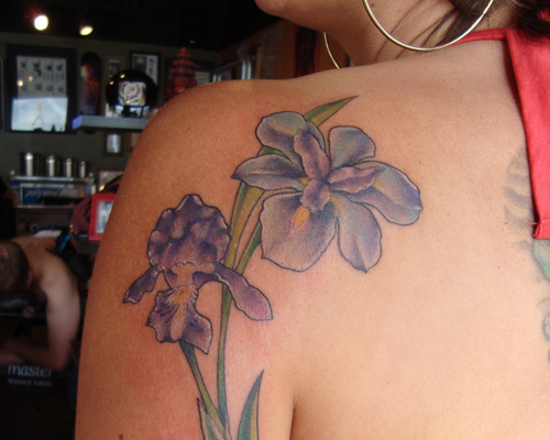 Lovely Purple Iris Flower Tattoo On Back Left Shoulder