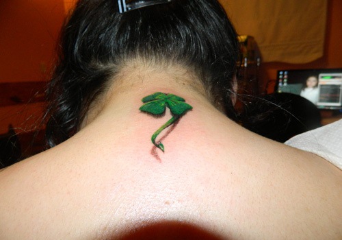 Lovely Realistic Four Leaf Shamrock With Shadow Tattoo On Back Neck