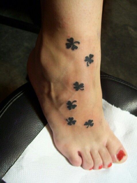 Lovely Shamrock Silhouette Leaves Tattoo On Right Foot