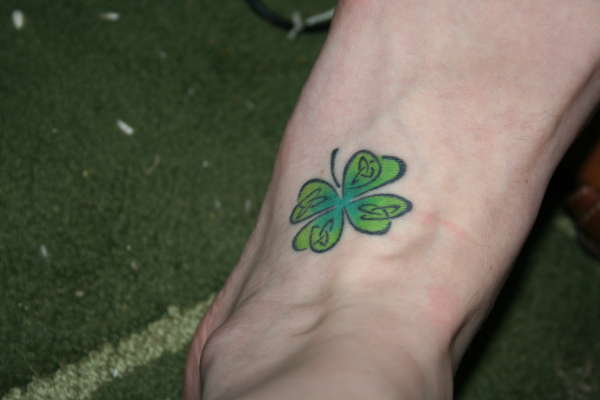 Lovely Small Four Leaf Shamrock In Celtic Style Tattoo