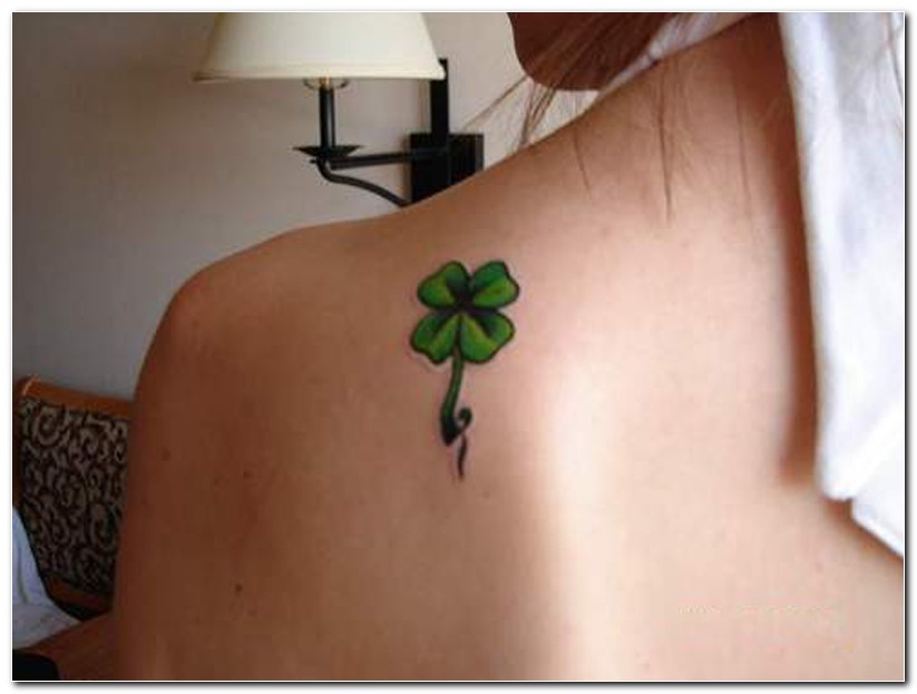 Lovely Small Four Leaf Shamrock Tattoo On Back Left Shoulder