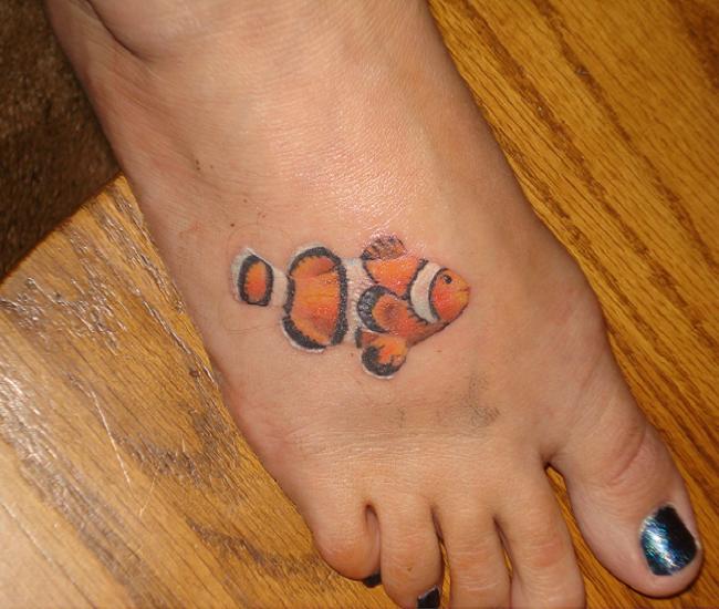 Lovely Small Saltwater Fish Tattoo On Foot