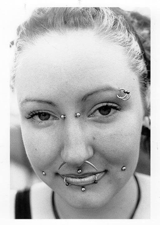Multiple Face And Cyber Bites Piercing Picture For Girls