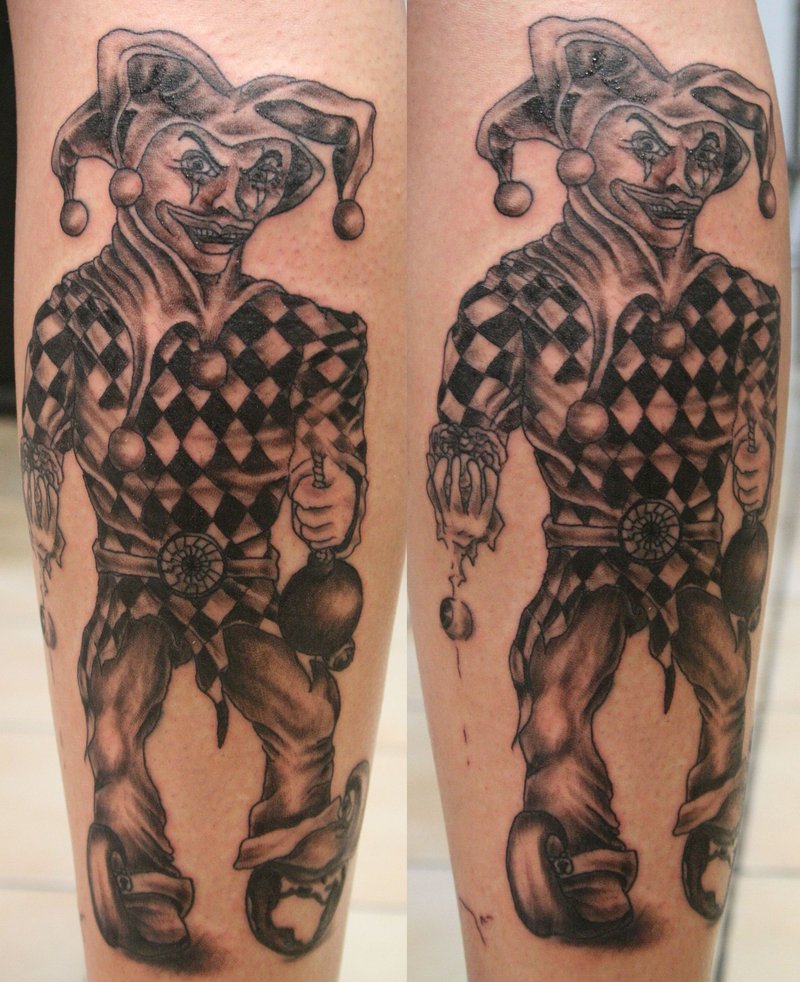Nice Black And Grey Evil Jester Holding Bomb Tattoo By 2FaceTattoos