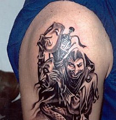 Nice Black And Grey Jester Holding Mask Tattoo On Right Shoulder