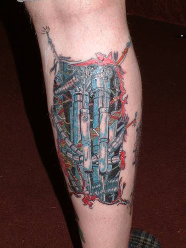 Nice Blue And Red Mechanical Tattoo On Leg