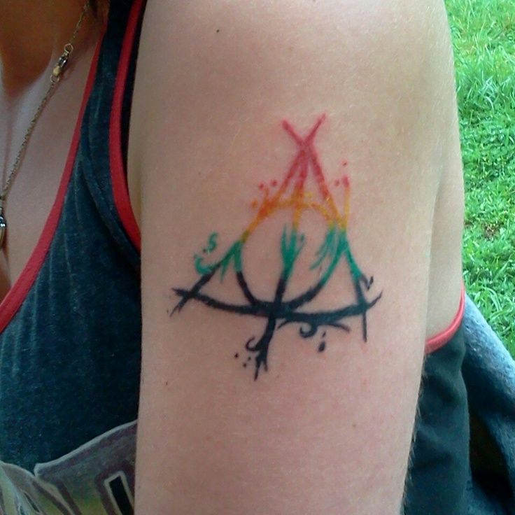 Nice Colored Deathly Hallows Tattoo On Left Shoulder