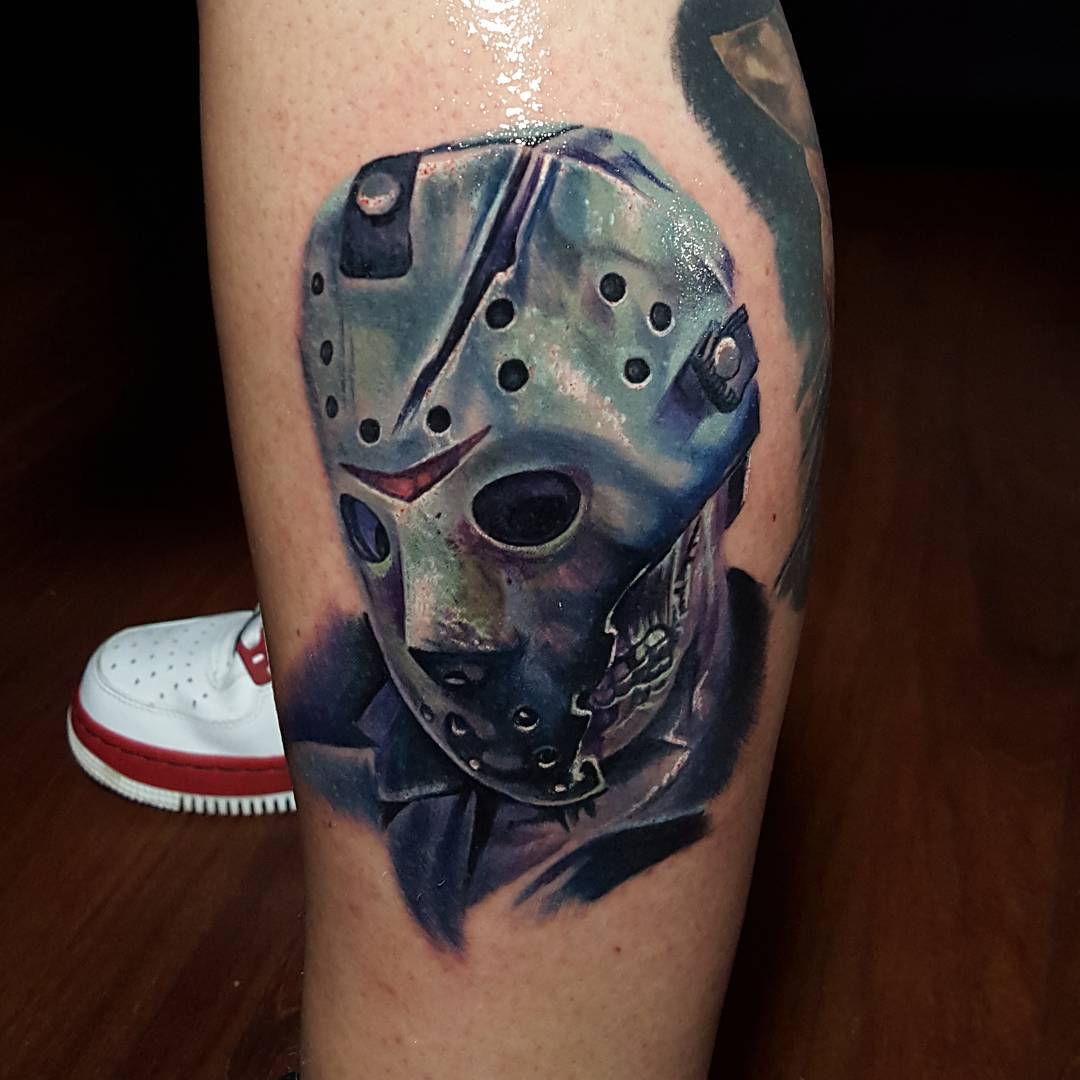 Nice Colored Jason Head Tattoo On Leg By Tyler Malek