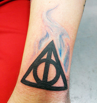 Nice Dark Black Deathly Hallows Tattoo On Wrist
