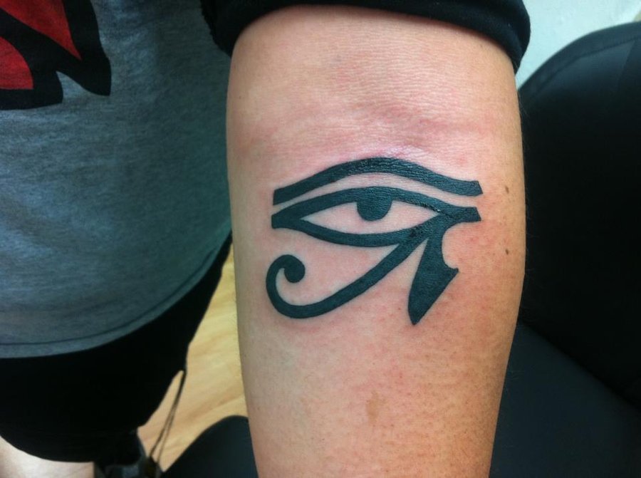 Nice Dark Black Horus Eye Tattoo On Forearm
