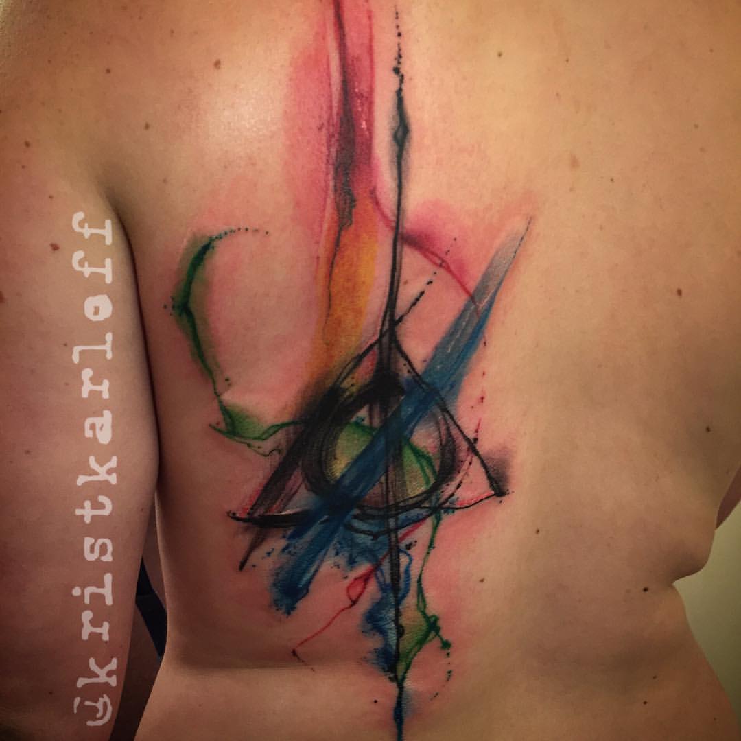 Nice Deathly Hallows Watercolor Back Tattoo.