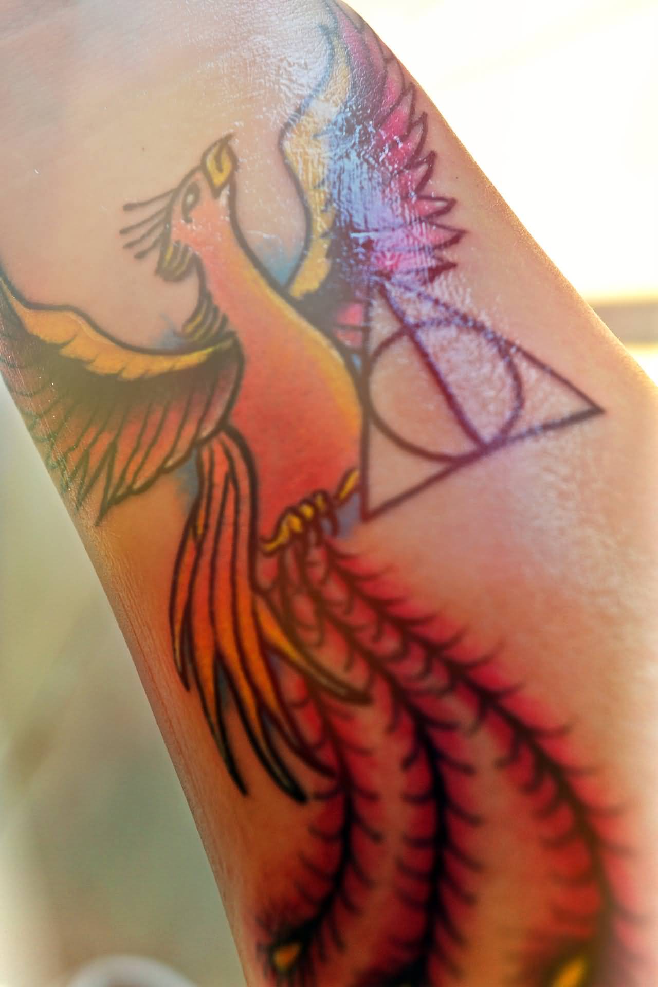Nice Deathly Hallows With Phoenix Tattoo