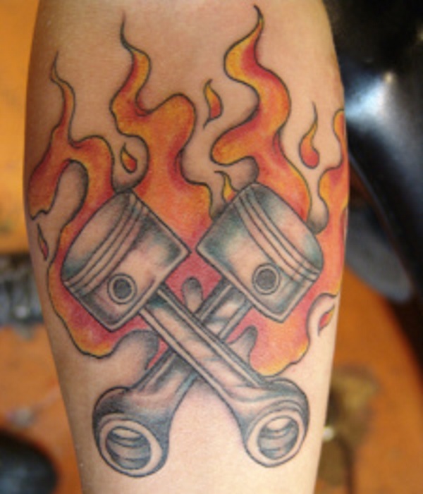 Nice Flaming Mechanical Parts Tattoo