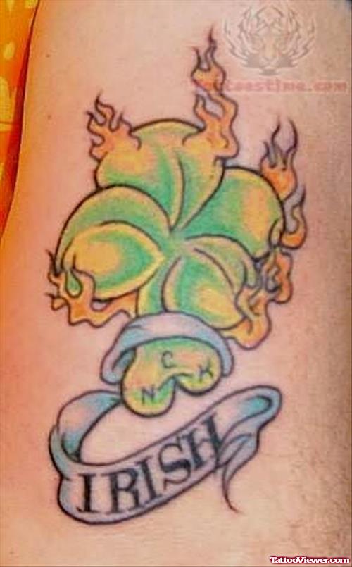 Nice Flaming Shamrock Leaf With Banner Tattoo